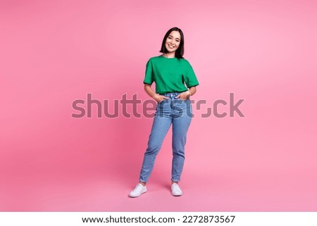 Full body portrait of stunning positive vietnamese lady put hands pockets posing isolated on pink color background