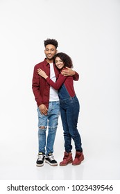 Full Body Portrait Of Young African American Hugging Couple, With Smile. Dating, Flirting, Lovers, Romantic Studio Concept, Isolated On White Background.