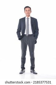 Full Body Portrait Of Young Business Man In Black Suit With Tie In Studio