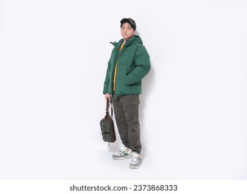 Full body Portrait of 
Young Man, student wearing jacket, hat, handbag Posing Over White Background
 - Powered by Shutterstock