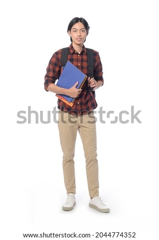 Full body portrait of young man with with backpack and notebooks in studio isolated on white background

