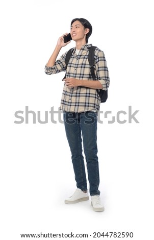 Full body portrait of young student, with backpack with    cellphone  on white background