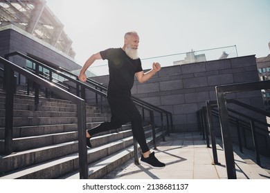 Full Body Profile Photo Of Aged Grey Hair Sporty Man Show Run Wear Black T-shirt Shorts Footwear Outside In Stadium.