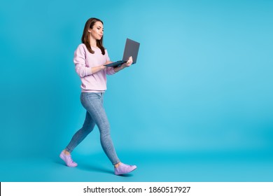 Full Body Profile Photo Of Attractive Business Lady Walk Office Hold Notebook Hands Meeting Video Call Busy Worker Wear Casual Purple Sweatshirt Jeans Footwear Isolated Blue Color Background