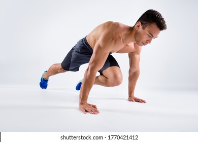 Full Body Profile Photo Of Handsome Sportsman Dark Skin Guy Stand On Hands Plank Position Changing Legs Doing Mountain Climber Exercise Wear Shorts Sneakers Isolated White Color Background