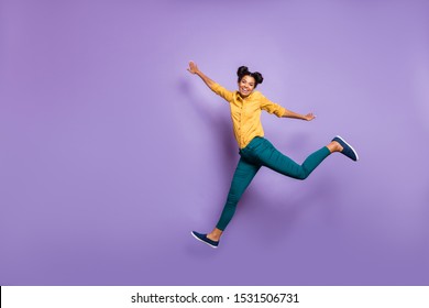 Full body profile photo of pretty dark skin lady jumping high hurrying sale shopping black friday season wear casual yellow shirt trousers isolated purple color background - Shutterstock ID 1531506731