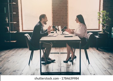 Full Body Profile Photo Of Two Business People Man Lady Press Conference Ask Answer Questions Speak Microphone Medical Corona Virus, Pandemic Convention Sit Opposite Modern Office Indoors