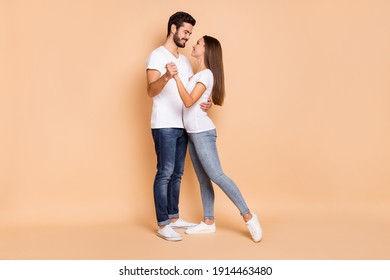 Full Body Profile Side Photo Of Young Couple Happy Positive Smile Hug Hold Hands Dance Romantic Isolated Over Beige Color Background