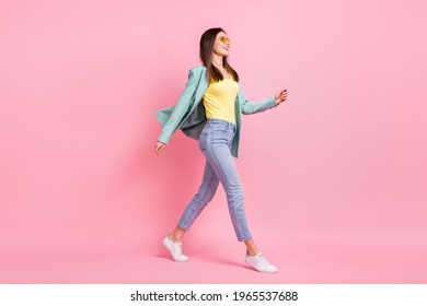 Full Body Profile Side Photo Charming Happy Young Woman Walk Empty Space Wear Glasses Isolated On Pink Color Background