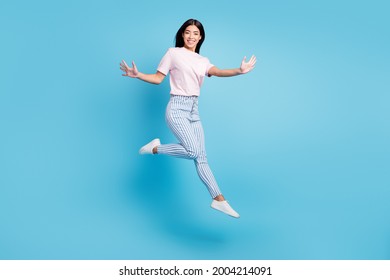 Full Body Profile Side Photo Of Young Asian Girl Happy Positive Smile Have Fun Jump Isolated Over Blue Color Background