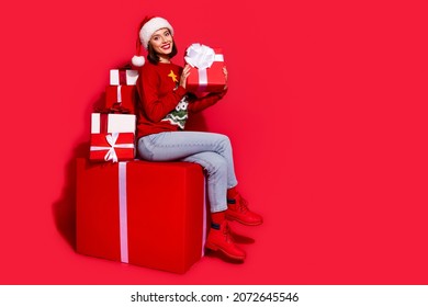 Full body profile side photo of youth lady gift ads shopping advent magic isolated over red color background - Powered by Shutterstock