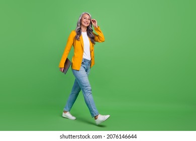 Full Body Profile Side Photo Of Retired Woman Go Agent Attorney Leader Isolated Over Green Color Background