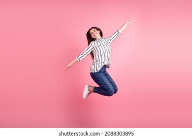 Full Body Profile Side Photo Of Young Pretty Woman Have Fun Jumper Arms Wings Isolated Over Pink Color Background