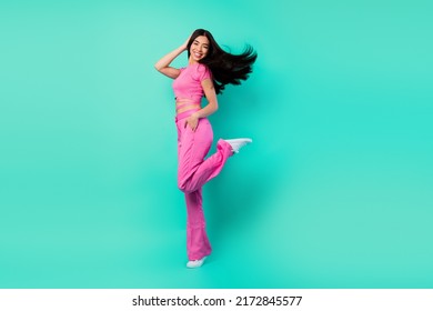 Full body profile side photo of stunning girl with long silky soft hair visit dancing party isolated on turquoise color background