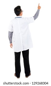 Full Body Rear View Of Asian Medical Doctor Pointing At Blank Space Standing Isolated On White Background