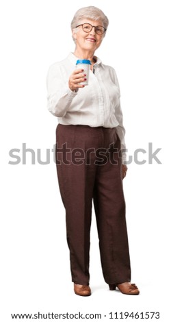Full body senior woman closeup of someone holding a coffee to go, concept of motivation, energy and vitality