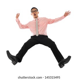 Full body shocked young Asian businessman falling backwards open arms, isolated on white background