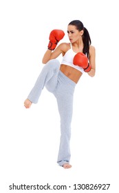 Full Body Shot Of Female Kick Boxer Over White Background