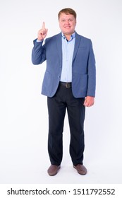 Full Body Shot Of Happy Overweight Businessman In Suit Pointing Up