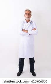 Full Body Shot Of Happy Senior Bearded Man Doctor Smiling While Standing With Arms Crossed Against White Background