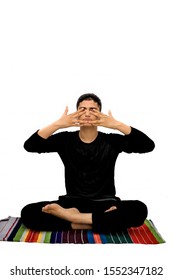 Full Body Shot Of Male Teenager Doing Bhramari Pranayama Or Human Humming Bee Pose Isolated On White Background.