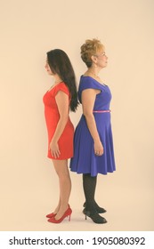 Full Body Shot Profile View Of Senior Asian Woman And Young Beautiful Woman Standing Back To Back