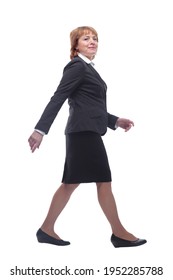 Full Body Shot Profile View Of Senior Businesswoman Walking