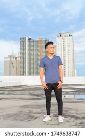 Full Body Shot Of Young Handsome Multi Ethnic Man Thinking Against View Of The City