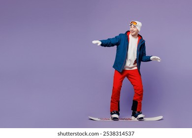 Full body side view smiling happy man he wear blue windbreaker jacket ski goggles mask hat snowboarding look aside spend extreme weekend winter season in mountains isolated on plain purple background - Powered by Shutterstock