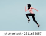 Full body side view young asian muslim fitness trainer sporty woman wear pink abaya hijab spend time in gym run fast jump high isolated on plain blue background studio. Workout sport fit abs concept