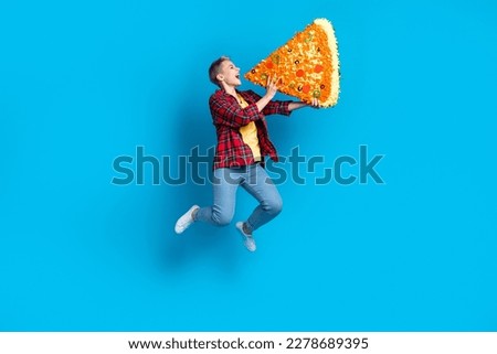 Full body size photo cadre of funny student girl blonde short hair hold huge piece pizza overeating hungry person isolated on blue color background