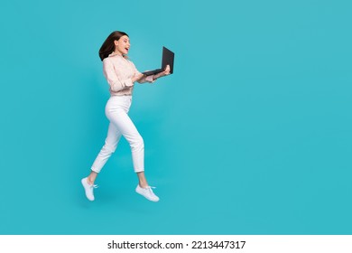 Full Body Size Photo Of Excited Dreamy Woman Wear Formal Outfit Jumping With Netbook Watching New Youtube Video Hobby Isolated On Blue Color Background