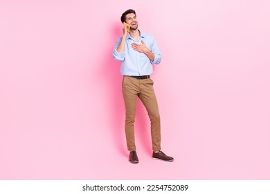 Full body size photo of young entrepreneur attractive man wear formal outfit talking laugh funny joke smart phone user isolated on pink color background - Powered by Shutterstock