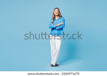 Similar – Image, Stock Photo Young woman in white wool sweater and black skirt sits barefoot in a northern German heath landscape in the fall in the grass between heather and smiles