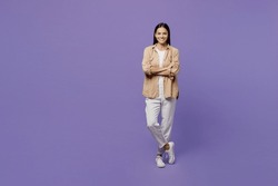 Full Body Smiling Happy Fun Young Latin Woman Wear Light Shirt Casual Clothes Hold Hands Crossed Folded Look Camera Isolated On Plain Pastel Purple Color Background Studio Portrait. Lifestyle Concept
