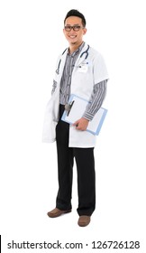 Full Body Southeast Asian Medical Doctor. Male Medical Doctor Holding A Clipboard Standing On White Background With Confident Smile.