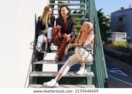 Similar – Couple of tourists walking down the street