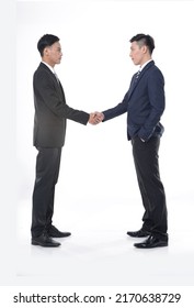 Full Body Two Young Businessmen Shaking Hands On White Background

