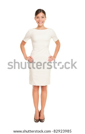 Full body woman portrait standing in business dress suit in full length isolated on white background. Beautiful young mixed race chinese asian / white caucasian businesswoman in her mid twenties