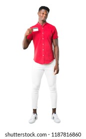 Full Body Of Young African American Man Holding A Credit Card On White Background