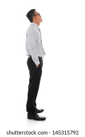 Full Body Young Asian Businessman Side View Looking Up. Standing Isolated On White Background