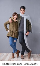 Full Body Young Couple Back To Back Standing Together Posing In Studio