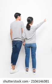 Full Body Young Couple In  Standing Together In Studio
Rear View

