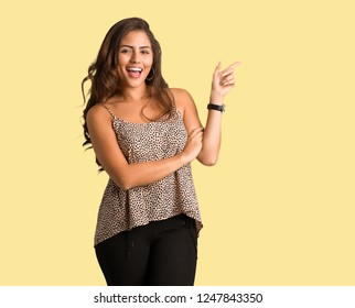 Full Body Young Curvy Plus Size Woman Pointing To The Side With Finger