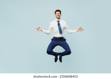 Full body young employee IT business man corporate lawyer wear classic formal shirt tie work in office spread hand in yoga om aum gesture relax meditate try calm down isolated on plain blue background - Powered by Shutterstock