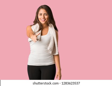 Full Body Young Fitness Curvy Woman Reaching Out To Greet Someone