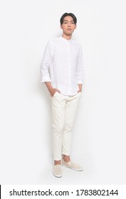 Full Body Young Handsome Man With Wearing Casual T-shirt With White Jeans Pants Standing Hands In Pockets 