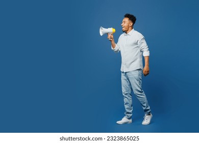 Full body young man of African American ethnicity he wear casual clothes shirt hold in hand megaphone scream announces discounts sale Hurry up isolated on plain dark royal navy blue background studio - Shutterstock ID 2323865025