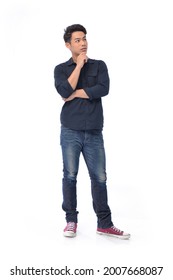 Full Body Young Man Wearing Blue Shirt With Jeans With Hand On Chin Thinking About Question,
Standing Posing In Studio,
