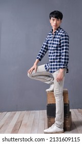 Full Body Young Man Wearing Checkered Shirt
 Paid Shirt With Khaki Pants Standing Posing In Studio
